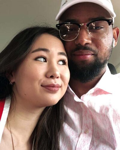 happy chinese girl with black man